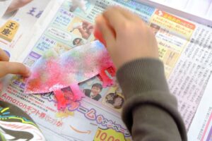 Child painting with watercolors in class